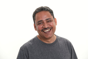 Fototapeta premium An Indian man in a studio against a white background