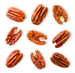 Peeled pecan nuts close-up on a white. Isolated - obrazy, fototapety, plakaty