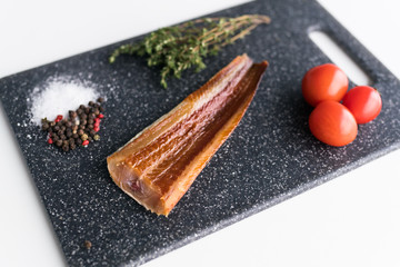 Fresh fish fillet, herbs and vegetables. Food background, ingredients on the table. Healthy food,...