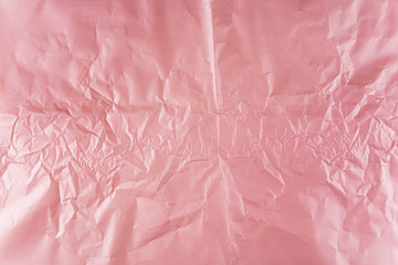 Crumpled pink gold and purple wrapping paper