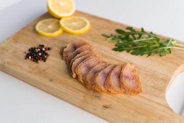 Fresh fish fillet, herbs and vegetables. Food background, ingredients on the table. Healthy food, styling, cooking concept.