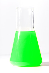 Flask for chemical experiments with green liquid