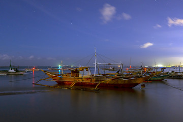 a resting fishing boat at night