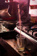 Pouring moroccan tea kettle to glass, restaurant, Essaouira
