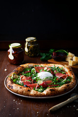 Pizza with prosciutto , arugula, burrata and parmesan cheese - 331021659