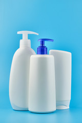 Three generic product tubes on blue background