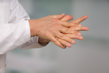 Close up of doctor's hand cleaning with disinfectant soap 