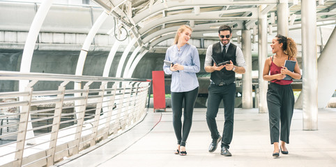 businessman and woman discussing about a meeting while walking in the city