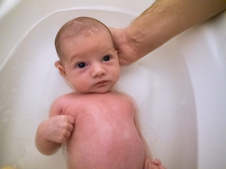 Little baby having a bath