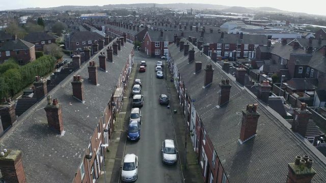 Aerial footage of terrace housing in one of Stoke on Trent's poorer areas, poverty and urban decline, council, social housing, immigration and council housing crisis,