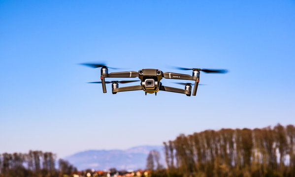 DJI Drone Mavic 2 Pro flying in rural area.
