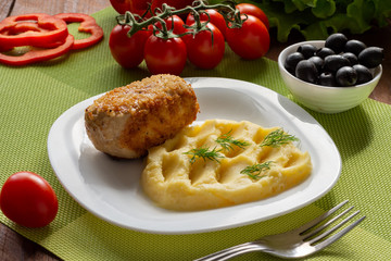 Cutlet in Kiev. Cutlets in breadcrumbs, stuffed with butter and herbs, served with potatoes. Still-life
