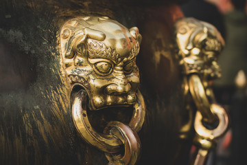 Close-up of a bronze handle of a ancient large bronze water tank, Forbidden City, Beijing China