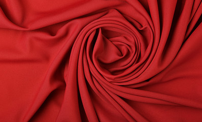 Background of red textile folded pleats