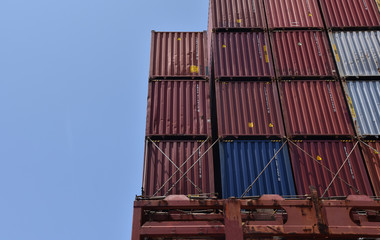 Stack of containers with cargo, loaded on deck of the container ship. International shipping of the...