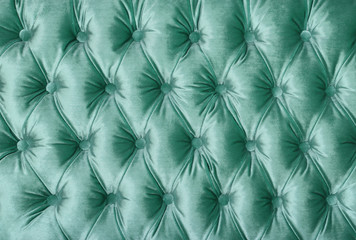 Green capitone tufted fabric upholstery texture