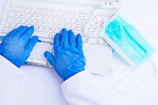 Coronavirus. Covid 19. Work in quarantine with blue gloves and mask.