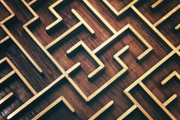 Wooden brown labyrinth maze puzzle close up
