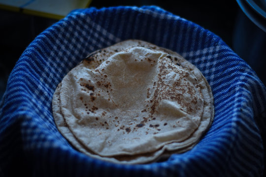 Woman Making A Indian Chapati On Gash  