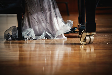 Woman in dress playing the piano
