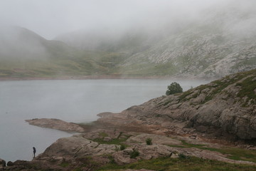 Ibón de anayet pyrenees. Goat skeleton head and lake