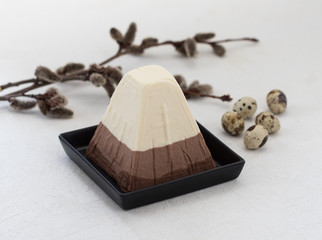 Dish dessert festive Easter cottage cheese three chocolates on a light background