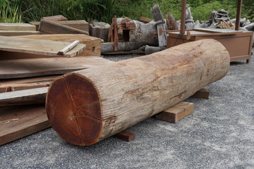 Large cut wood logs for use in construction.