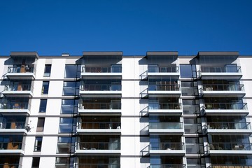 Modern apartment buildings on a sunny day with a blue sky. Facade of a modern apartment building