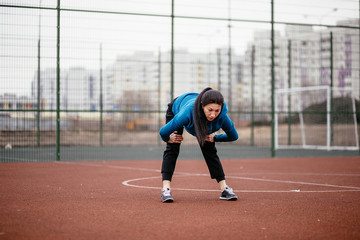Fototapeta premium A young woman is engaged in sports on the Playground.