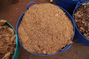 Close-up to wood sawdust in basket.