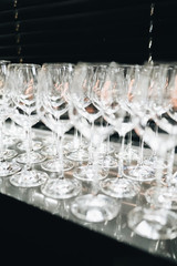 Many clean wineglasses in bar, professional equipment