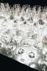 Many clean wineglasses in bar, professional equipment