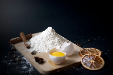 Baking ingredients on a dark background top view.