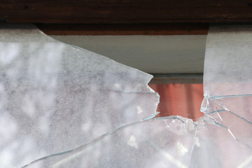 Broken window of abandoned house outdoors, closeup. Requiring repair - obrazy, fototapety, plakaty