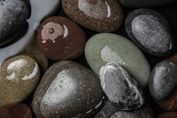 Pile of stones in water as background, top view. Zen lifestyle