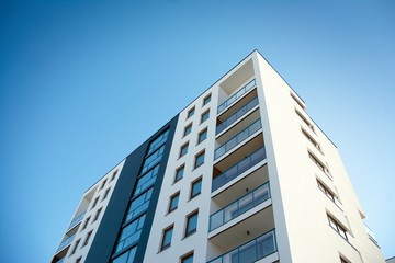 Modern apartment buildings on a sunny day with a blue sky. Facade of a modern apartment building