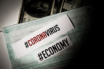 Corona virus impact on American economy and European economy crisis concept, banknotes with medical mask