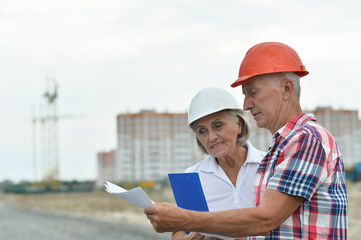 Portrait of senior couple at building site