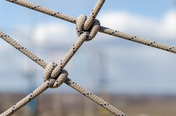 many ropes and one big knot close up