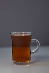 A glass of tea. Black tea