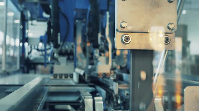 Factory machine is processing cardboard sheets