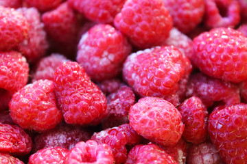 Fresh frozen raspberries. Close-up. Background. Texture.
