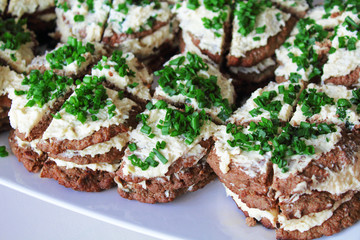Liver cake with garlic, cheese and mayonnaise. Close-up. Background.