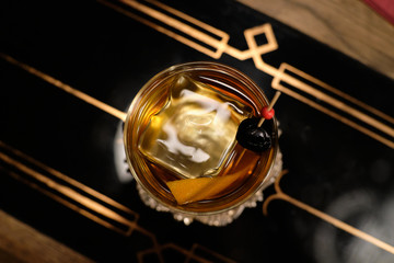 Perfect Old Fashioned cocktail with cherry and orange zest