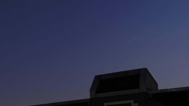 Night to morning time lapse with a builiding