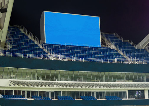 Large LED screen in stadium with empty seats. Scoreboard for sport matches