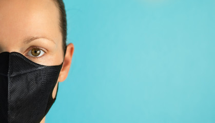 Closeup of woman wearing face mask. Coronavirus concept. 