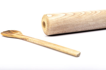 wooden spoon and rolling pin on white background