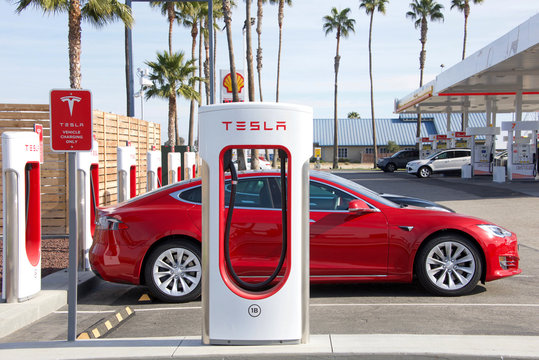 Bakersfield, CA - December 18, 2017: Tesla Supercharging Station on the Stockdale Hwy and 5 fwy. Tesla Supercharger stations allow Tesla cars to be fast charged at the network within an hour.