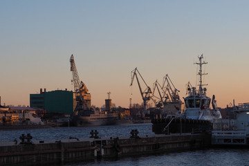 view of the cargo port with floating cranes